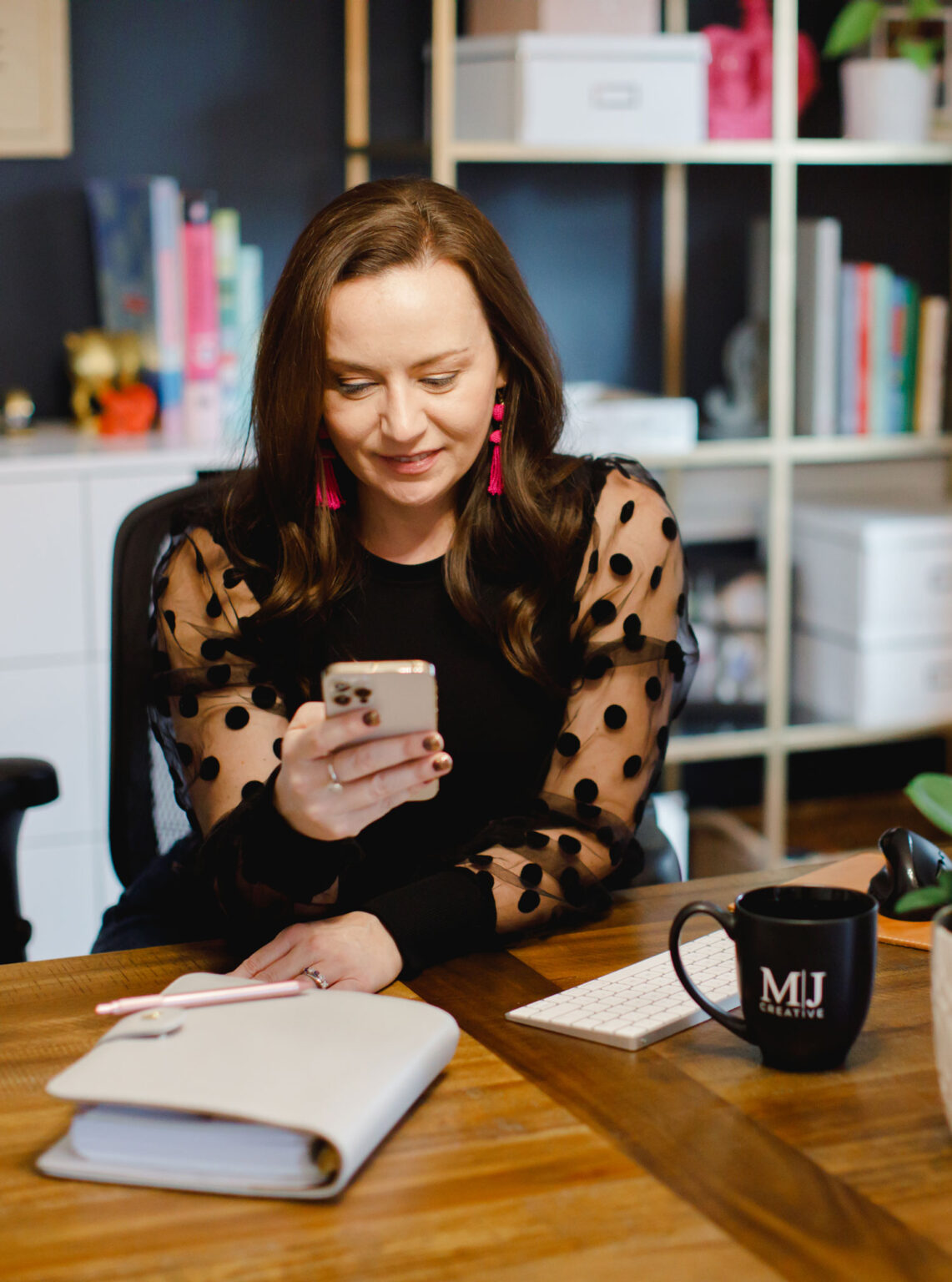 Charlotte website developer contacting a client on an iPhone